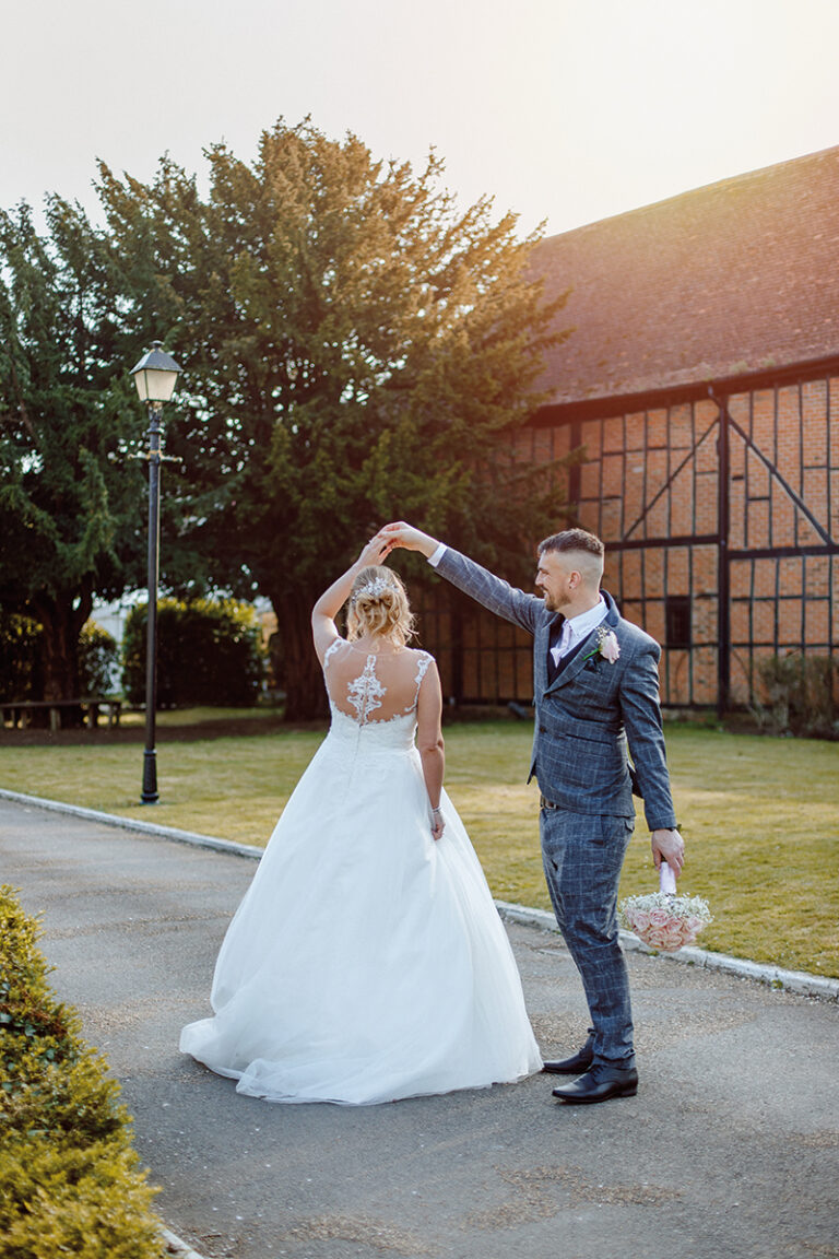 Couple dancing on the driveway at The Tithe Barn, Bedford