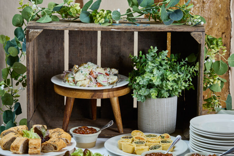 A table of food laid out for a buffet